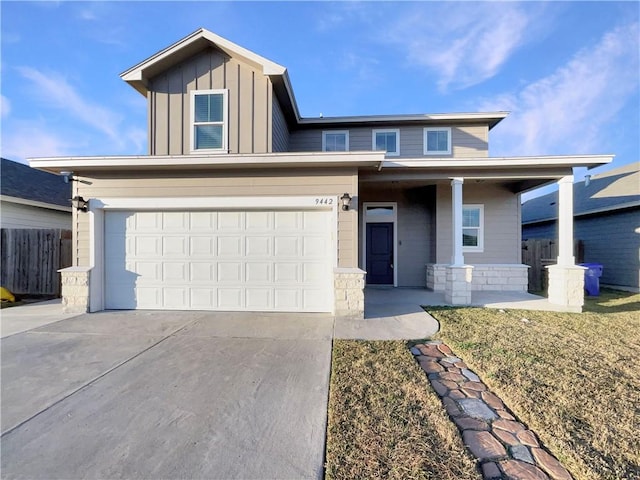 view of front of house featuring a garage and covered porch