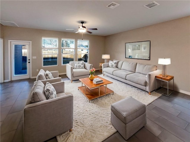 living room featuring hardwood / wood-style flooring and ceiling fan