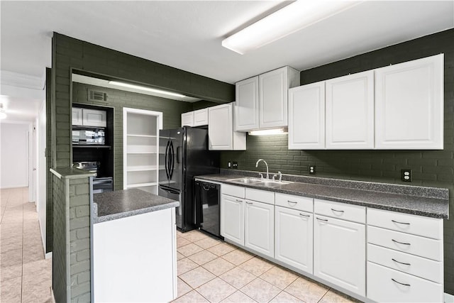 3402 Ocean Dr Unit 16, Corpus Christi, TX 78411 - kitchen with black appliances, light tile patterned floors, white cabinets, and dark countertops