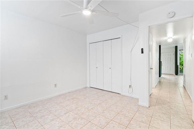 3402 Ocean Dr Unit 16, Corpus Christi, TX 78411 - unfurnished bedroom featuring light tile patterned flooring, a closet, and ceiling fan