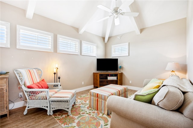 living room with ceiling fan, wood-type flooring, and beamed ceiling