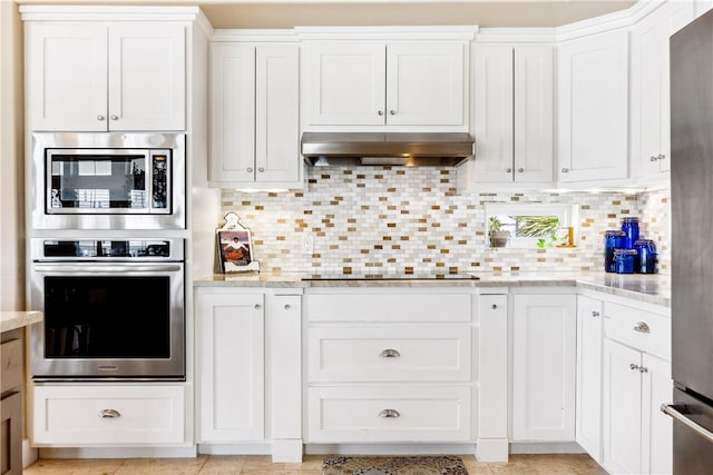 kitchen featuring white cabinetry, appliances with stainless steel finishes, and exhaust hood