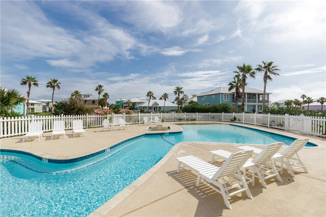 view of swimming pool with a patio area