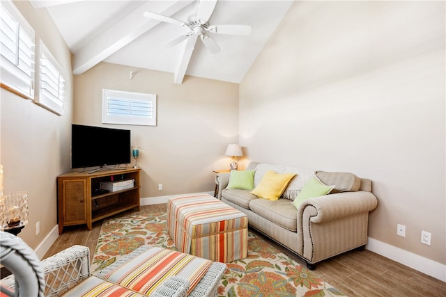 living room with light hardwood / wood-style floors, ceiling fan, and vaulted ceiling with beams