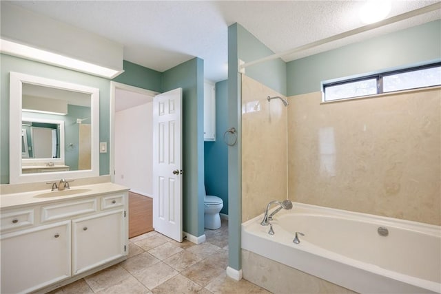 full bathroom featuring vanity, tub / shower combination, toilet, and a textured ceiling