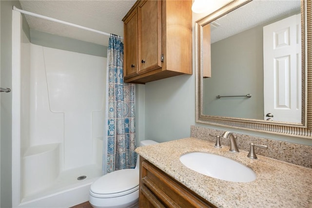 bathroom with a shower with shower curtain, vanity, toilet, and a textured ceiling