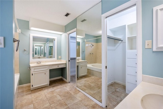 bathroom with vanity and independent shower and bath