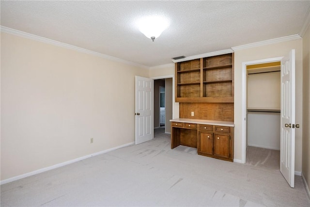 unfurnished bedroom with light carpet, a closet, a textured ceiling, and ornamental molding