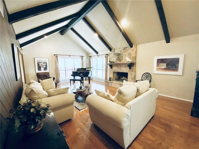 living room featuring vaulted ceiling with beams, wood walls, wood-type flooring, and a fireplace