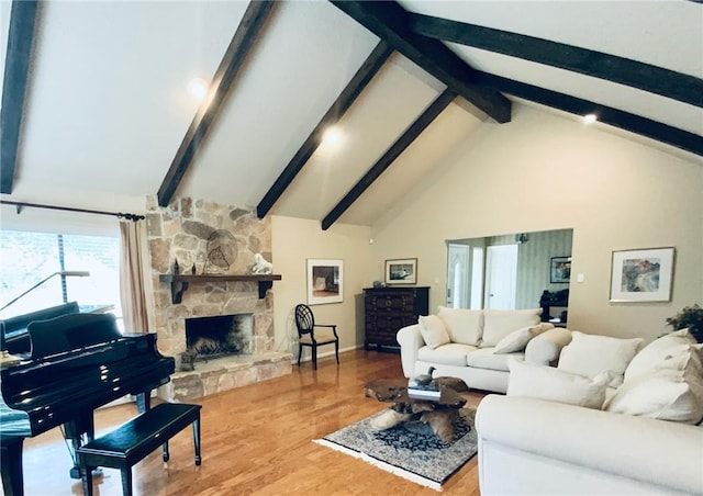 living room with a stone fireplace, beamed ceiling, wood-type flooring, and high vaulted ceiling