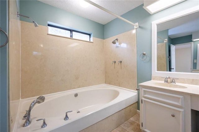 bathroom with vanity, a textured ceiling, shower / bathtub combination, and tile patterned flooring