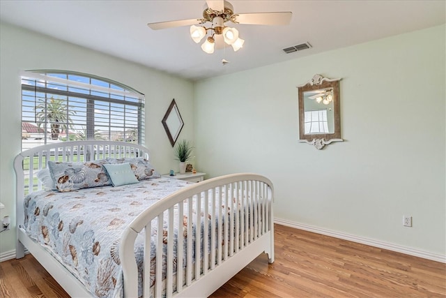 bedroom featuring ceiling fan and wood-type flooring