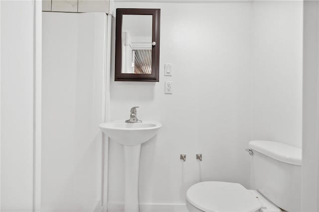 bathroom featuring toilet