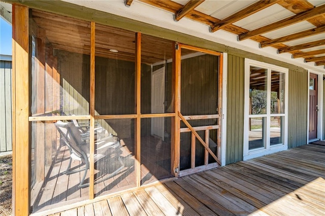 interior space with beam ceiling and hardwood / wood-style flooring