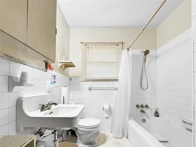 bathroom featuring tile patterned flooring, shower / bath combo, toilet, and tile walls