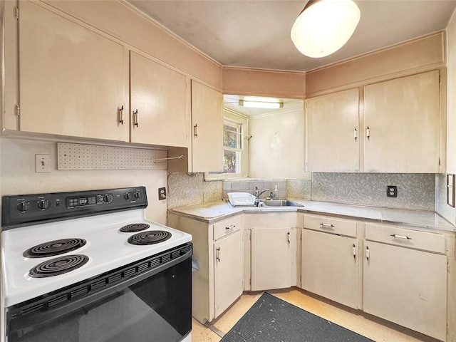 kitchen with tasteful backsplash, white range with electric cooktop, and crown molding