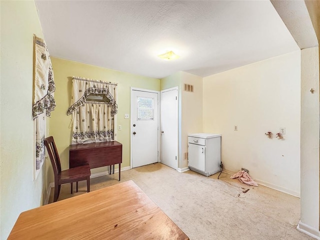 view of carpeted foyer