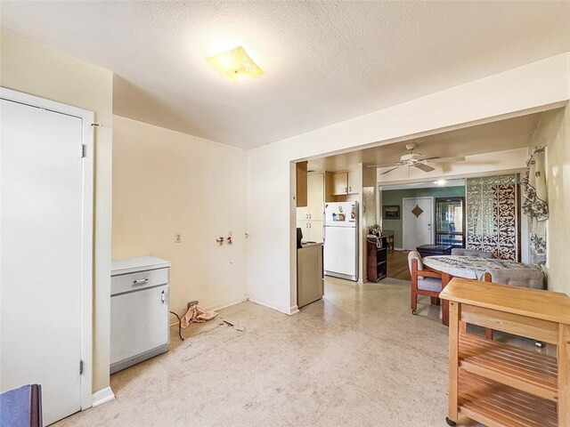 3434 Kay St, Corpus Christi, TX 78411 - kitchen with freestanding refrigerator, ceiling fan, baseboards, and a textured ceiling