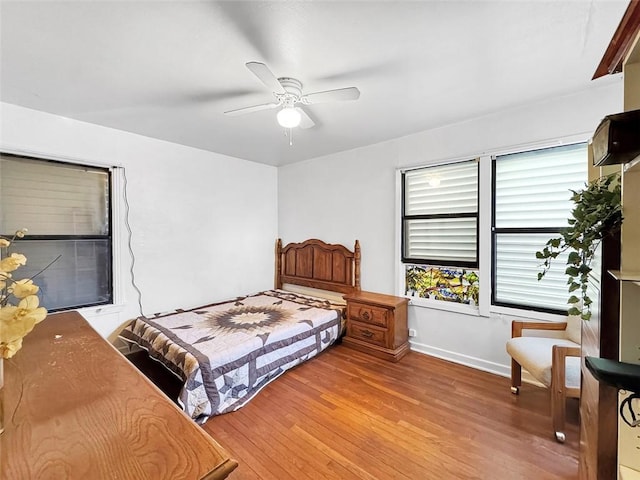 bedroom featuring hardwood / wood-style floors and ceiling fan