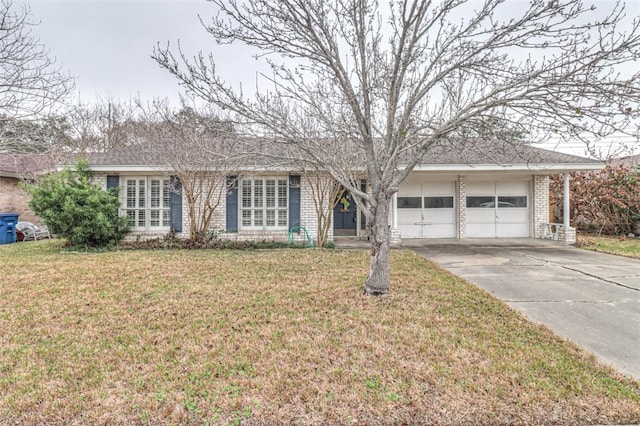 ranch-style home featuring a garage and a front yard