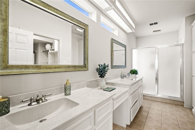 13726 Cayo Gorda Ct, Corpus Christi, TX 78418 - full bathroom featuring double vanity, tile patterned flooring, a shower stall, and a sink