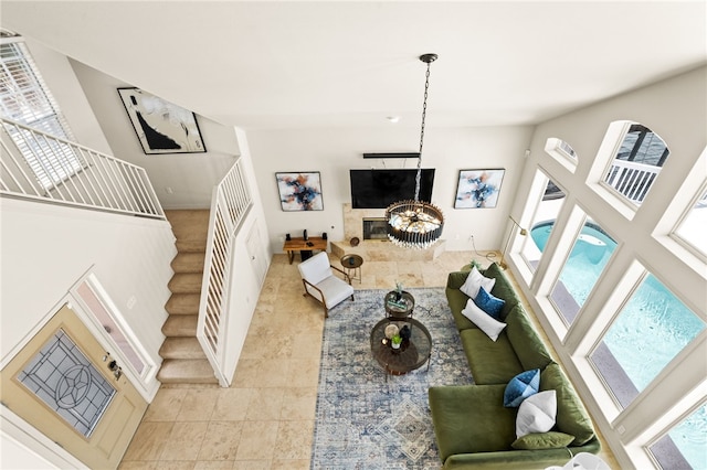 13726 Cayo Gorda Ct, Corpus Christi, TX 78418 - living room with stairway, light tile patterned flooring, a high ceiling, and a healthy amount of sunlight