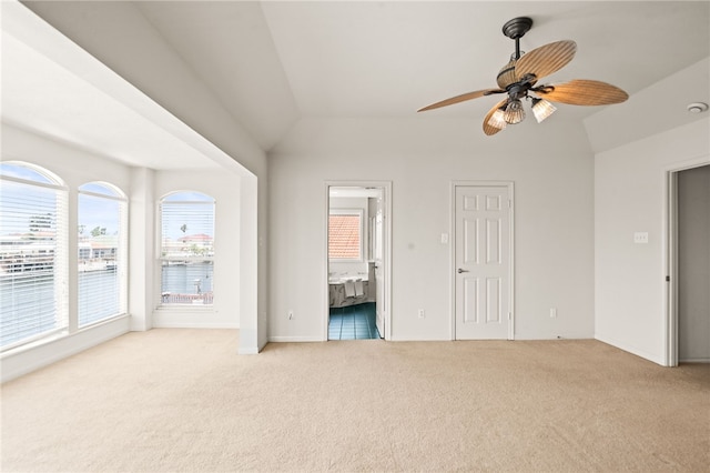 13726 Cayo Gorda Ct, Corpus Christi, TX 78418 - unfurnished bedroom featuring carpet flooring, ensuite bath, vaulted ceiling, and baseboards