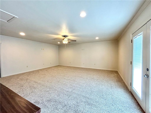 carpeted spare room featuring ornamental molding and ceiling fan