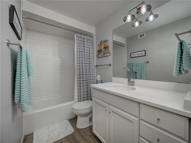 6649 Seacomber Dr Unit 309, Port Aransas, TX 78373 - full bath with vanity, toilet, wood finished floors, and shower / bathtub combination with curtain