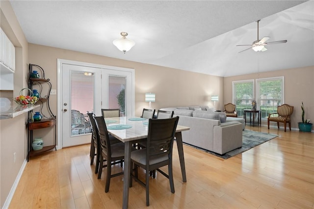 2301 Cyprus Dr, Ingleside, TX 78362 - dining space featuring light wood-type flooring, ceiling fan, baseboards, and lofted ceiling