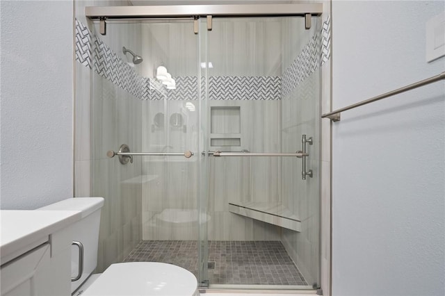 2301 Cyprus Dr, Ingleside, TX 78362 - full bathroom with toilet, a shower stall, and vanity