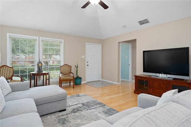 2301 Cyprus Dr, Ingleside, TX 78362 - living area with ceiling fan, light wood-style floors, lofted ceiling, and baseboards