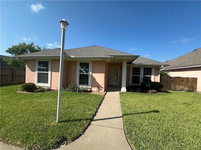 2301 Cyprus Dr, Ingleside, TX 78362 - view of front of property with stucco siding and roof with shingles