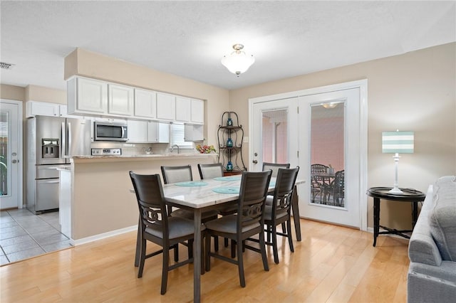 2301 Cyprus Dr, Ingleside, TX 78362 - dining area with light wood finished floors and baseboards