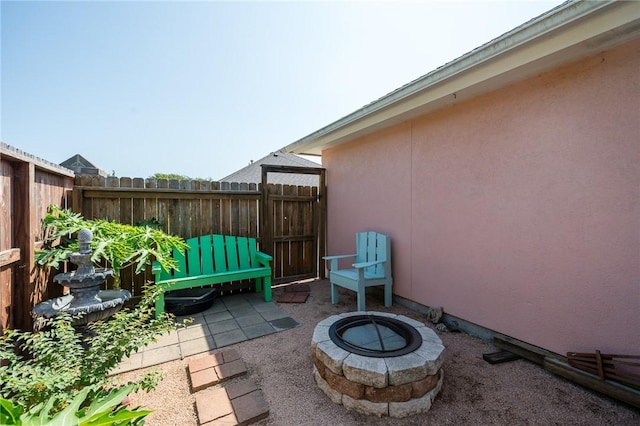 2301 Cyprus Dr, Ingleside, TX 78362 - view of patio with an outdoor fire pit