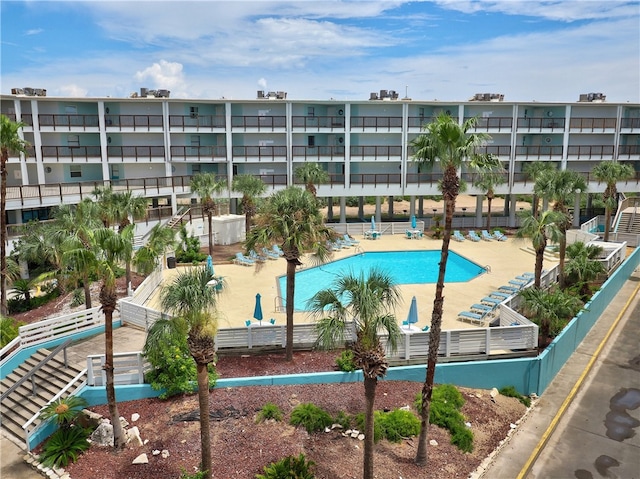 view of swimming pool featuring a patio area