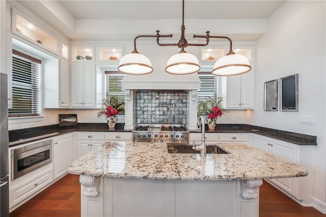 134 La Joya Prt, Aransas, TX 78373 - kitchen featuring stainless steel appliances, white cabinets, and dark wood-style floors