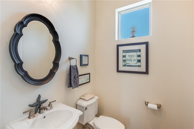 bathroom with sink and toilet