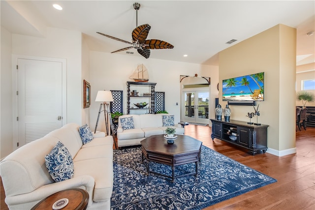 living room with hardwood / wood-style flooring and ceiling fan