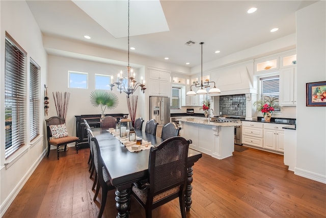 dining area featuring dark hardwood / wood-style flooring