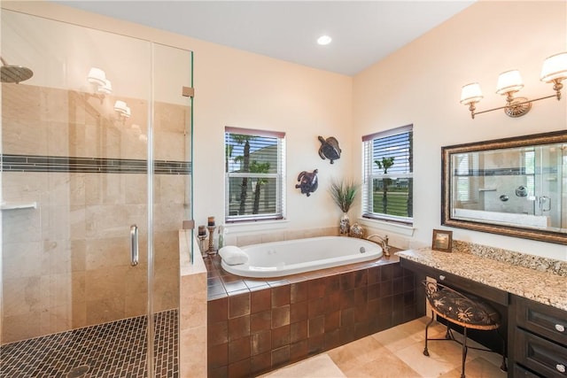 134 La Joya Prt, Aransas, TX 78373 - full bath featuring a shower stall, a bath, tile patterned flooring, vanity, and recessed lighting
