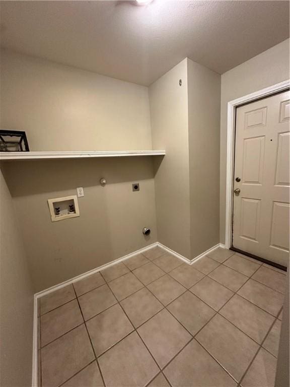 laundry room featuring washer hookup, light tile patterned floors, hookup for an electric dryer, gas dryer hookup, and laundry area