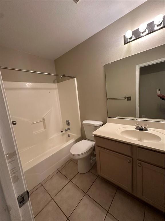 full bathroom featuring tile patterned flooring, toilet, vanity, and shower / tub combination