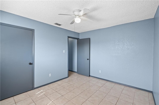 9574 Goldfinch, Corpus Christi, TX 78418 - unfurnished bedroom featuring ceiling fan, baseboards, a textured ceiling, and visible vents