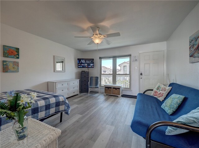 bedroom with light hardwood / wood-style flooring and ceiling fan