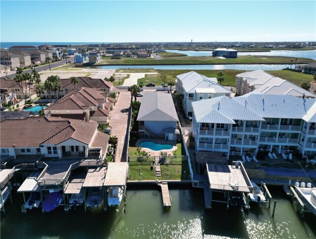 birds eye view of property featuring a water view