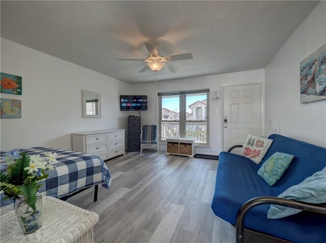 bedroom with ceiling fan and light hardwood / wood-style flooring