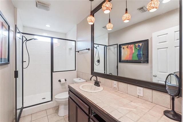 bathroom with vanity, a shower with shower door, tile patterned flooring, and toilet