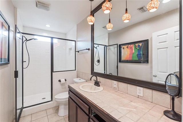 bathroom featuring a shower stall, toilet, tile patterned floors, and vanity