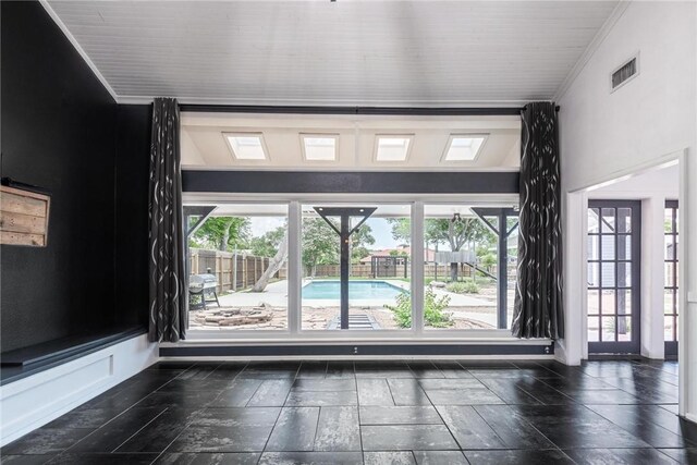 spare room featuring plenty of natural light and ornamental molding